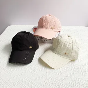 Lightweight breathable baseball cap set in pink black and white with gold metal logo