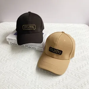 Black and khaki baseball caps with sparkling mumu embroidery and structured pineapple cloth