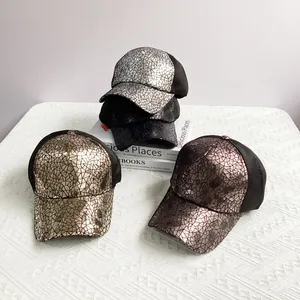 Detail of four metallic cracked pattern trucker hats with breathable mesh in assorted colors