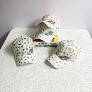 Breathable lace baseball cap with rhinestone butterflies shown in four stylish colors
