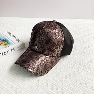 Detail of hip-hop baseball cap with bronze geometric mosaic texture and black breathable mesh