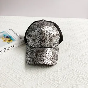 Detail of silver cracked mirror texture and breathable mesh on hip hop baseball cap