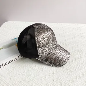 Detail view of silver cracked texture brim and black mesh on the hip-hop baseball cap