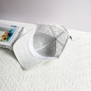 Detail view of white lace baseball cap with interior sweatband and adjustable metal buckle