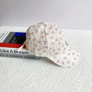 Detailed close-up of lace breathable baseball cap with floral print and metal buckle