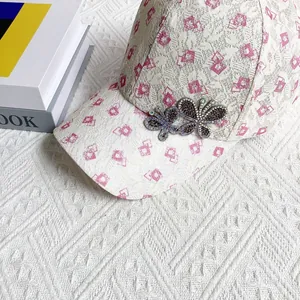 Detailed macro view of lace baseball cap featuring exquisite double rhinestone butterfly