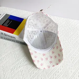 Internal structure of breathable lace baseball cap with pink floral mesh and plastic support