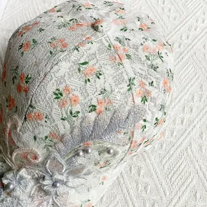 Detailed embroidery with purple floral lace and pearls on this breathable baseball cap