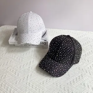 Close-up of sparkling rhinestone baseball cap with detailed crystal embellishments