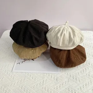 Close-up of wool octagonal beret hats in four colors featuring vertical rhinestone accents