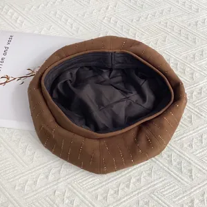 Detail of wool beret with vertical rhinestone stripes and adjustable inner lining