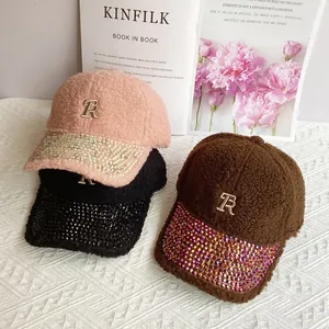 Lamb wool baseball caps with rhinestone brims and metallic letter R embroidery detail