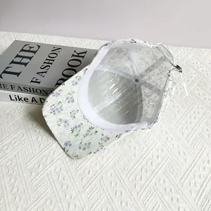 Detail of floral baseball cap lining with internal support and adjustable metal buckle