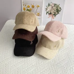 Detailed pile of fuzzy baseball caps with rhinestone music notes in five various colors