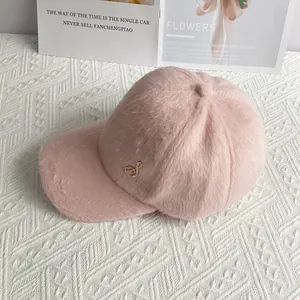 Detailed close-up of pink velvet baseball cap with sparkling crystal musical note emblem