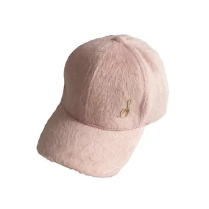 Pink velvet baseball cap with rhinestone musical note ornament on a clean white background