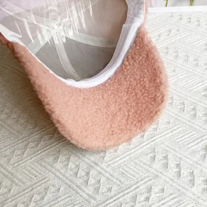 Close-up of pink sherpa baseball cap showing plush texture and internal structure