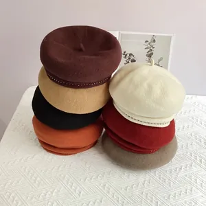 Classic wool beret hat for women with stud trim shown in multiple stylish colors