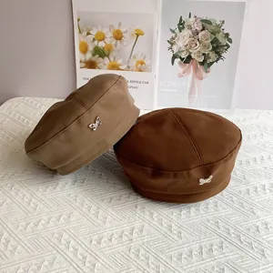 Vintage wool beret hats with metal butterfly tags in khaki and dark brown colors