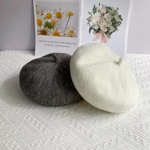 Close-up of sequined chenille knit beret showing soft texture and sparkly details