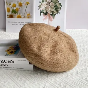 Detail of light brown chenille beret showing knit texture and shimmering sequins