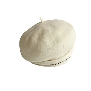 Classic cream wool beret with retro rivet trim and minimalist silhouette design