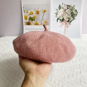 Close-up of pink chenille knit beret featuring subtle silver sequins and soft texture