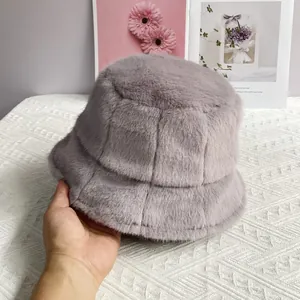Detail of lilac faux mink fur bucket hat showing plush texture and patchwork design
