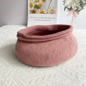 Pink sequin chenille knit beret hat for women on white textured surface background