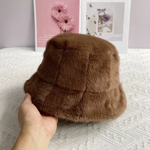 Close-up of soft dark coffee faux mink fur texture on a warm winter bucket hat