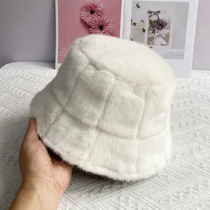 Detail of white faux mink fur bucket hat with luxury textured checkerboard pattern