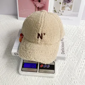 Sherpa fleece baseball cap weighing 105g on a scale to show its lightweight comfort