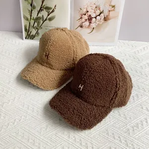 Winter faux shearling baseball cap with embroidered H letter in khaki and brown colors
