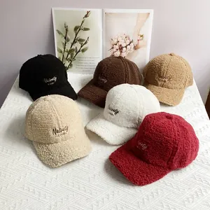 Close-up of lamb wool baseball caps showing six colors with Naivety 1768 embroidery