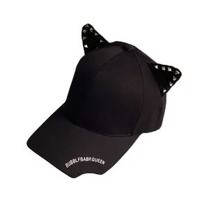 Punk black baseball cap with 3D cat ears and silver rivets on a white background