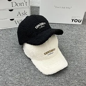 Winter faux shearling baseball caps with embroidery in black and beige colors