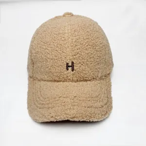 Khaki faux shearling baseball cap with embroidered H letter in a stylish winter design