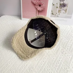 Detailed interior view of the beige fleece baseball cap with structural hat support