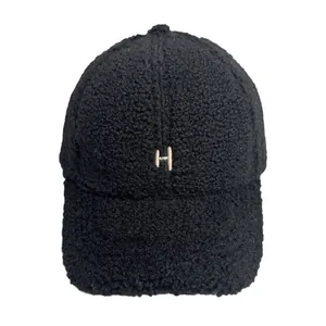 Women's black fluffy sherpa baseball cap with white embroidered H letter design