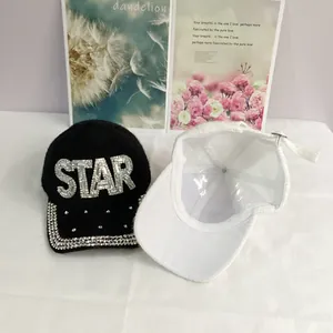 Detail of baseball caps showing STAR rhinestone embroidery and inner lining with buckle