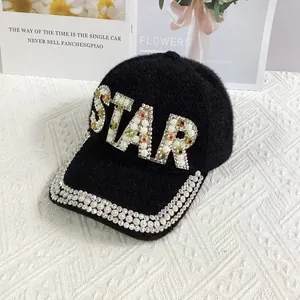 Detail of STAR lettering with pearls and rhinestones on black plush baseball cap