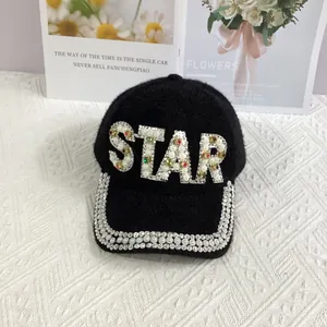 Detail of STAR lettering with pearls and rhinestones on black faux mink baseball cap