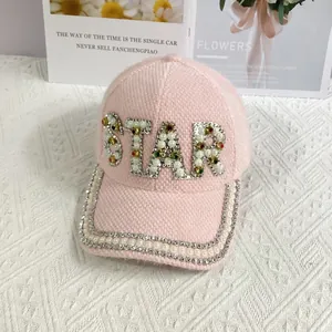 Detail of pink faux mink baseball cap with pearl and rhinestone STAR embellishment