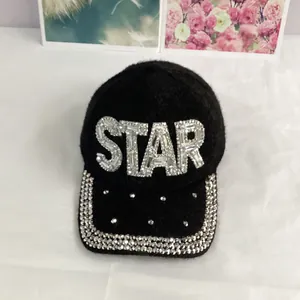 Detail of sparkling rhinestone STAR lettering on a black mink velvet baseball cap