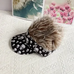 Detail of the creative visor hat with skull patterns and brown synthetic hair wig top