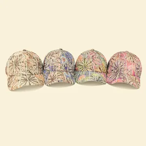 Detail of four baseball caps with floral print, diagonal stripes and rhinestone accents