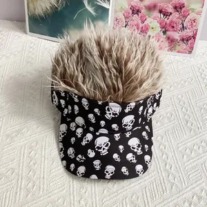 Close-up of black sun visor featuring white skull prints and funny brown wig hair