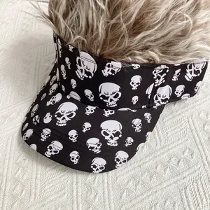 Close-up of black baseball visor with skull print and light brown synthetic hair wig