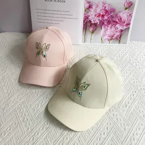 Fashion baseball caps with rhinestone butterfly design in pink and beige cotton fabric