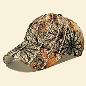 Stylish baseball cap with palm leaf print, sparkling rhinestones, and metal star studs